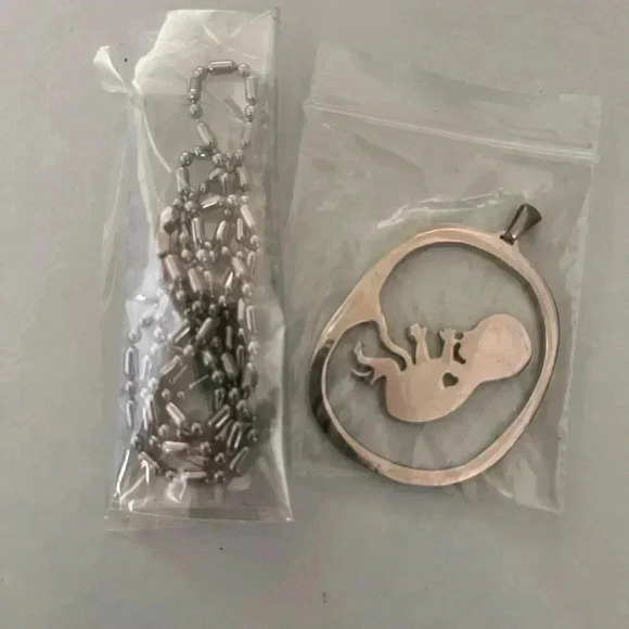 Jewelry - Fetus necklace new still in packaging